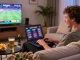 Engaging evening with non UK licensed casinos, featuring a person enjoying online gambling on a laptop in a stylish living room.