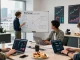 Team collaborating on libertyswap cross-chain trading strategies in a modern office